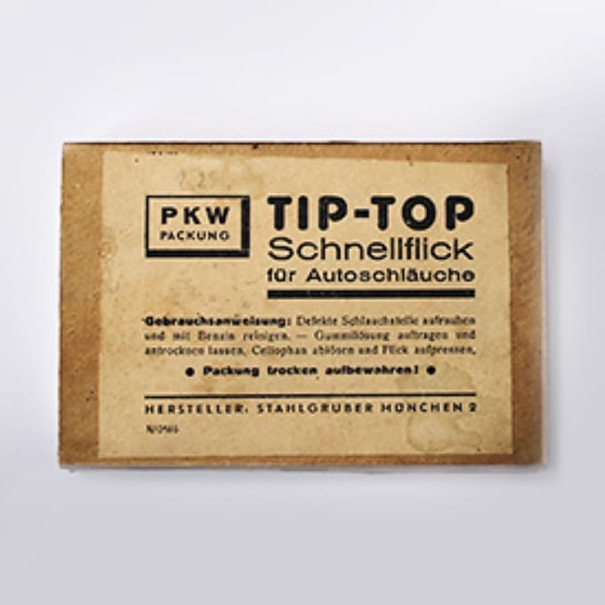 A rectangular, vintage packaging labeled TIP-TOP Schnellflick für Autoschläuche with instructions and manufacturer details in German on a beige background.