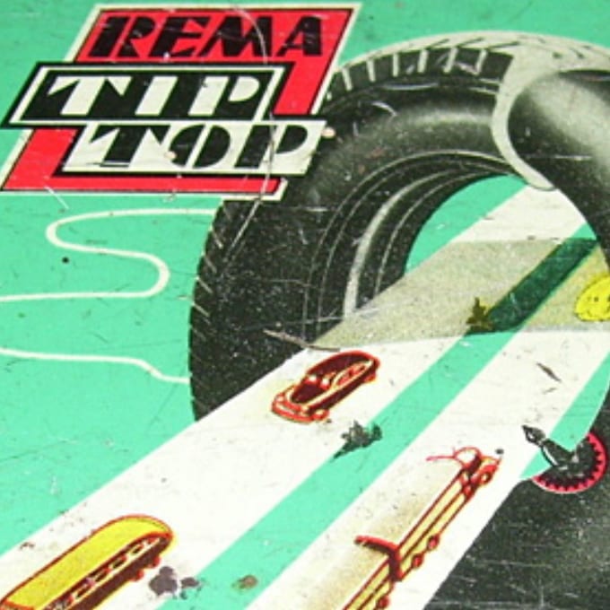 A close-up of vintage REMA TIP TOP packaging featuring a large tire and cars on a green background with bold text.